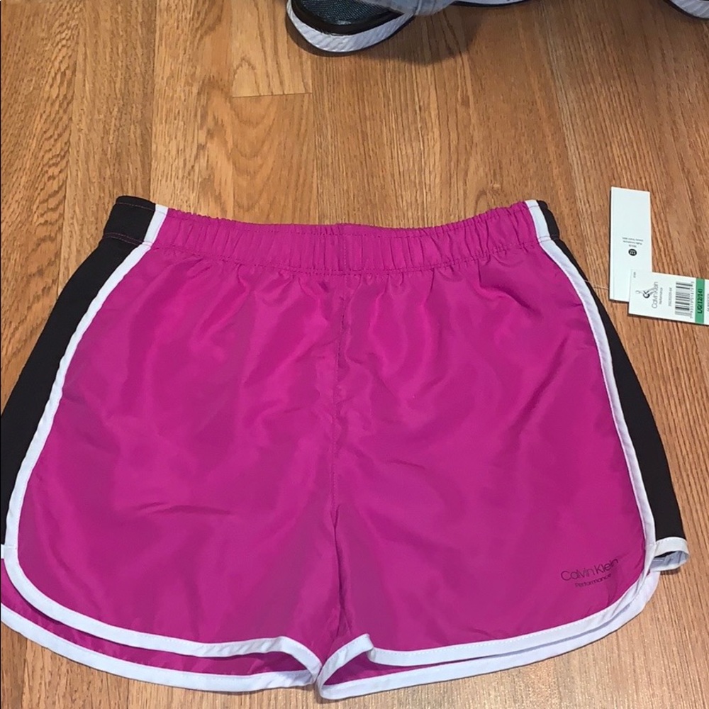 Calvin Klein performance magenta workout shorts.